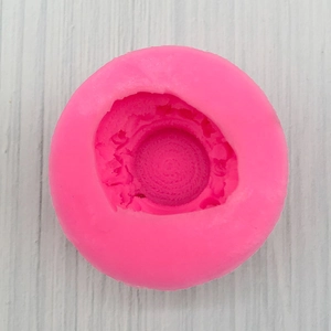 Macro detail of pink silicone mold with spiral texture for DIY soap and cake decor