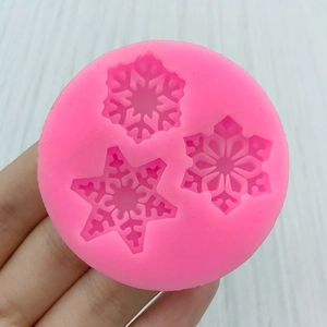 Pink silicone snowflake mold with three patterns for DIY soap and chocolate baking