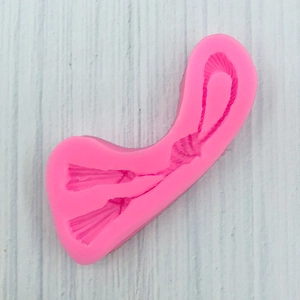 Moule détaillé en silicone rose pour fondant ou chocolat en forme de nœud chinois