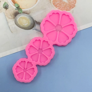 Detailed view of pink triple flower silicone mold for DIY soap and chocolate making