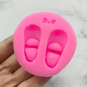Pink silicone mold for baby shoes and bow fondant cake decorations and soap making