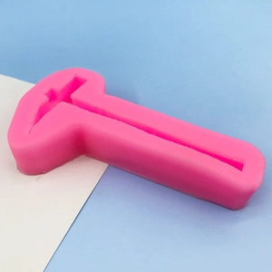 Pink silicone mold with T-shape logo design for chocolate, cakes, and DIY crafts