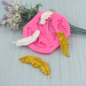 Pink feather silicone fondant mold with detailed gold and white embossed craft results