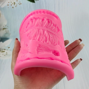 Large pink silicone mold for fondant cake decor featuring detailed feather texture