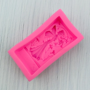Detailed close-up of pink 3D angel girl silicone mold with ZUHDTT1542 engraving