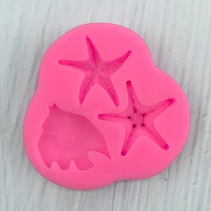 Pink silicone mold with starfish and tropical fish shapes for DIY cake decorating