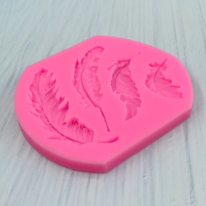 Pink silicone feather mold with four detailed textures for fondant and DIY crafts