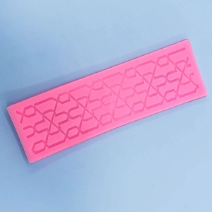 Pink silicone lace mold featuring geometric diamond pattern for fondant cake borders