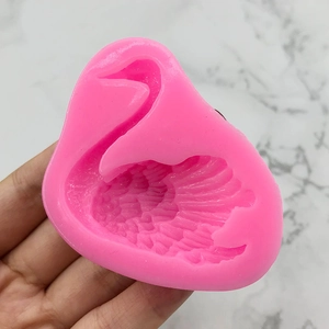 Pink swan silicone fondant mold with detailed feather textures for baking cake decoration