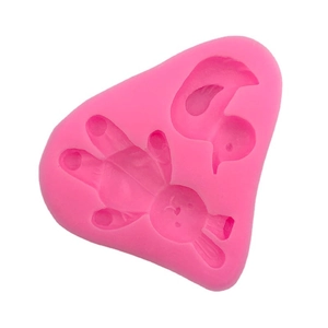 Pink silicone mold featuring cute cartoon rabbit and bird shapes for fondant cake decorating