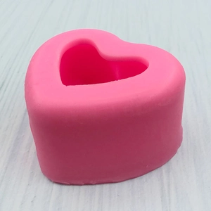 Top view of pink heart-shaped silicone mold for DIY soap, candles, and cake decorating