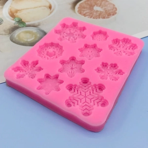 Pink silicone snowflake mold with 10 cavities for baking fondant and chocolate decoration