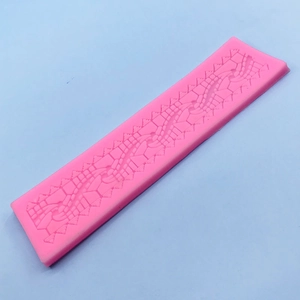 Pink silicone lace mold for fondant cake borders with geometric pattern and serrated edges