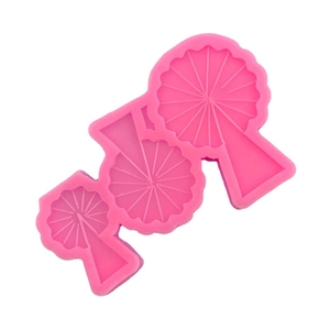 Three sizes of pink Ferris wheel and tree shaped silicone molds for DIY cake fondant crafts
