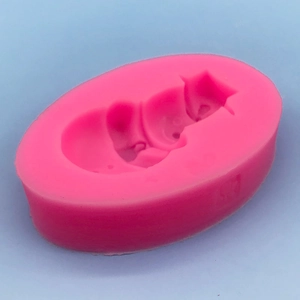 Pink silicone mold featuring a sleeping baby design for fondant and handmade soap crafting