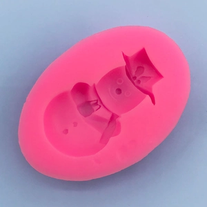 Macro detail of a pink snowman silicone mold for Christmas baking and fondant