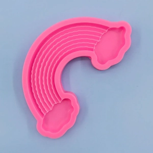 Detailed close-up of a pink silicone rainbow cloud mold for fondant and cake decoration