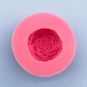 Detailed top view of pink silicone rose flower mold for DIY fondant and soap making