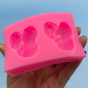 Silicone peanut mold for chocolate and fondant decoration in light pink color