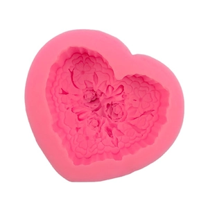 Pink heart-shaped silicone mold with detailed rose flower patterns for cake and soap