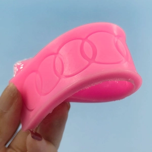 Pink silicone ring mold featuring interlocking circles with soft and flexible texture