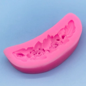 Pink crescent silicone mold with feather floral patterns for DIY cake border and fondant