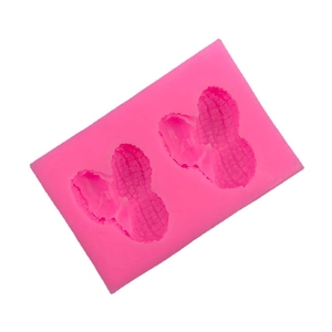 Pink silicone peanut mold for cake decoration, chocolate, and candle making with 2 cavities
