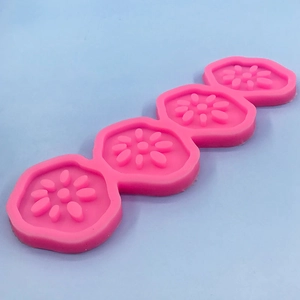 Daisy shaped silicone fondant mold for chocolate and mousse with four cavities in pink