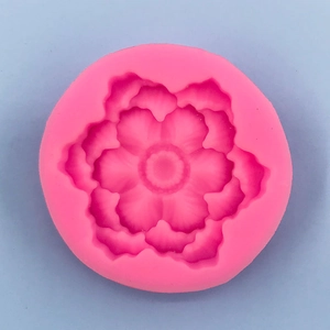 Macro shot of pink lotus flower silicone mold showing detailed petal textures for DIY cakes
