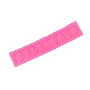 Pink silicone fondant mold with circular lace pattern for decorative cake borders