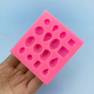 Pink silicone mold with 16 geometric shapes for DIY resin jewelry and cake decorating