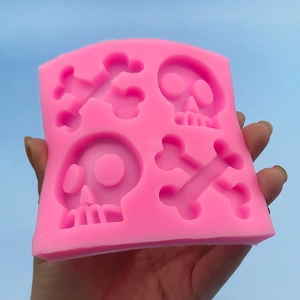 Pink silicone skull and crossbones mold for Halloween chocolate fondant cake baking