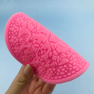 Pink semi-circle silicone embossed mold with flower textures for fondant cake decorating