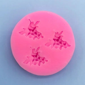 Detailed top view of pink silicone grape leaf mold for chocolate cake and candle DIY