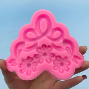 Pink silicone mold with flower and vine patterns for DIY fondant and chocolate cake borders