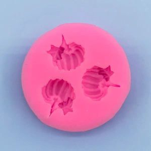 Top view of pink silicone pumpkin leaf molds for Halloween baking and DIY cake decoration
