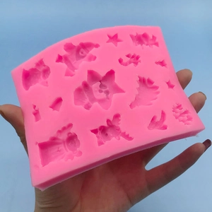 Pink silicone Christmas mold with snowflakes, stars and trees for baking and DIY