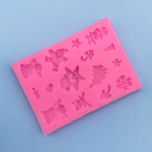 Detailed macro view of pink silicone Christmas mold featuring snowflake and star shapes
