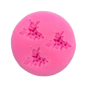 Round pink silicone mold featuring three leaf shapes for cake decorating and DIY crafts