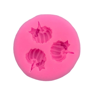 Pink silicone round mold featuring three pumpkin shapes for Halloween cake baking decoration