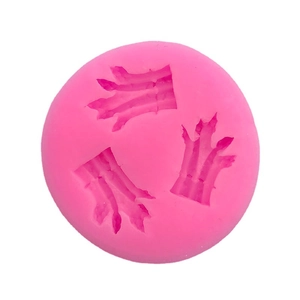 Pink silicone mold with three bird claw patterns for chocolate and cake baking
