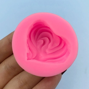 Pink heart-shaped silicone mold with rippled texture for fondant cakes and handmade soap