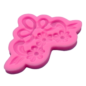 Pink silicone mold featuring daisy flowers and vine patterns for fondant and DIY crafts