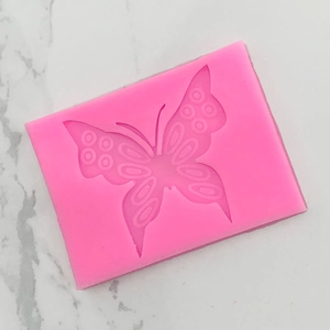 Detail view of the pink butterfly silicone mold for fondant and chocolate baking
