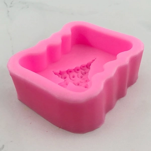 Pink rectangular silicone mold with Christmas tree pattern for handmade soap and cakes