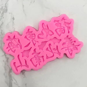 Macro detail of pink silicone mold with Chinese longevity characters on marble