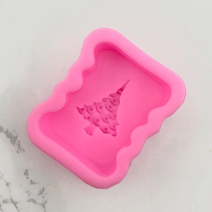 Detail of pink silicone Christmas tree mold for DIY cake fondant and soap crafts