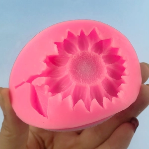 Pink silicone sunflower mold for chocolate and fondant cake decorating with floral details