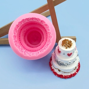 Bright pink 3D multi-layered cake silicone mold with heart-patterned cake model sample