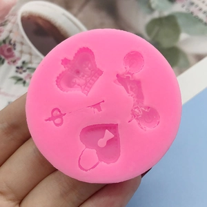Pink silicone mold with heart lock, key, and crown shapes for DIY cake fondant and crafts